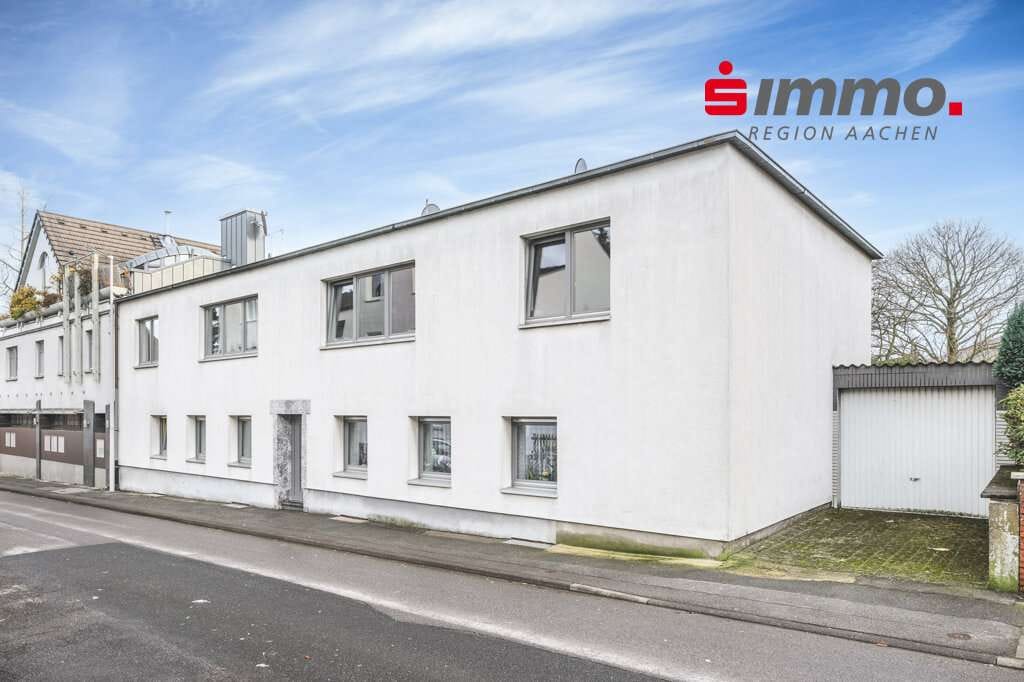 Immobilie in Alsdorf - Vermietetes 4-Parteienhaus mit Garten und Garage - Bild 0