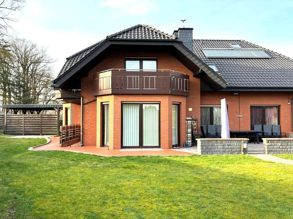Immobilie in Merzen - Modernisiertes Wohnhaus mit 2 vermieteten Einliegerwohnungen, Sauna, Doppelgarage und großem Garten - Bild 0