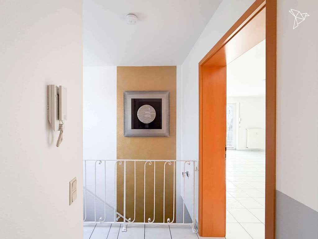 Immobilie in Holzwickede - BESONDERES WOHNGEFÜHL AUF ZWEI EBENEN 🏡 Lichtdurchflutete Maisonette mit Terrasse in Holzwickede! - Bild 1