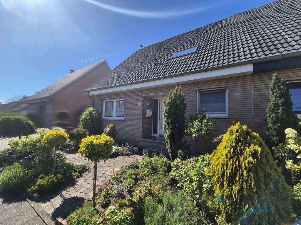Immobilie in Sonsbeck - Mediterranes Wohngefühl in herrlich ruhiger Lage – gepflegte Doppelhaushälfte mit Wohlfühlgarten! - Bild 1