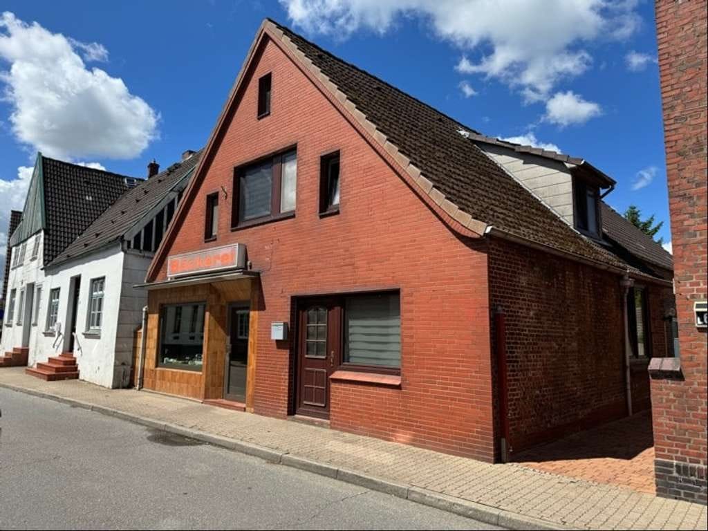 Immobilie in Wewelsfleth - Haus mit Ladengeschäft und Wohnung in Dorflage - Bild 1