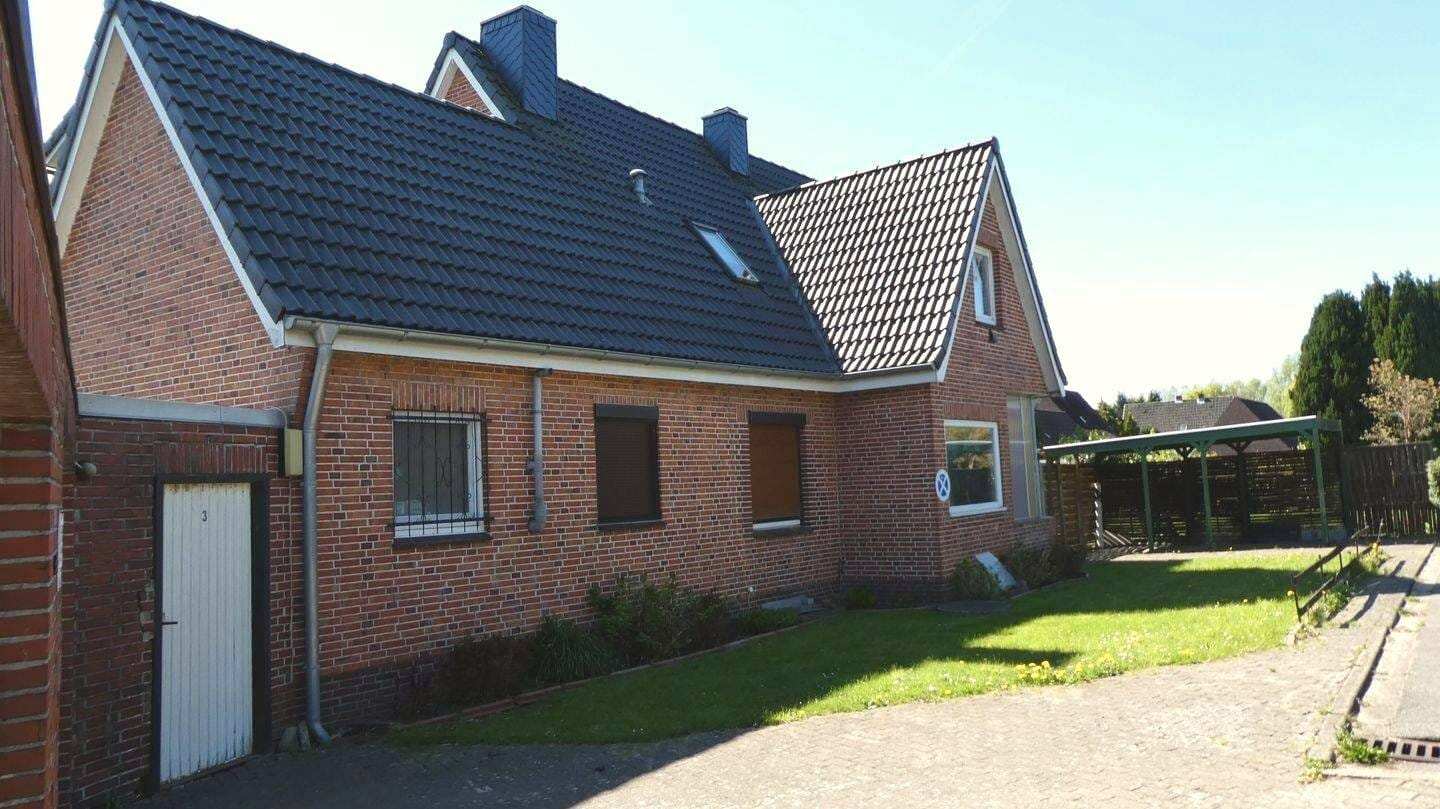 Immobilie in Kiebitzreihe - +++ Geräumiges Siedlungshaus mit großem Garten, Garage und Carport, in ruhiger Lage +++ - Bild 1