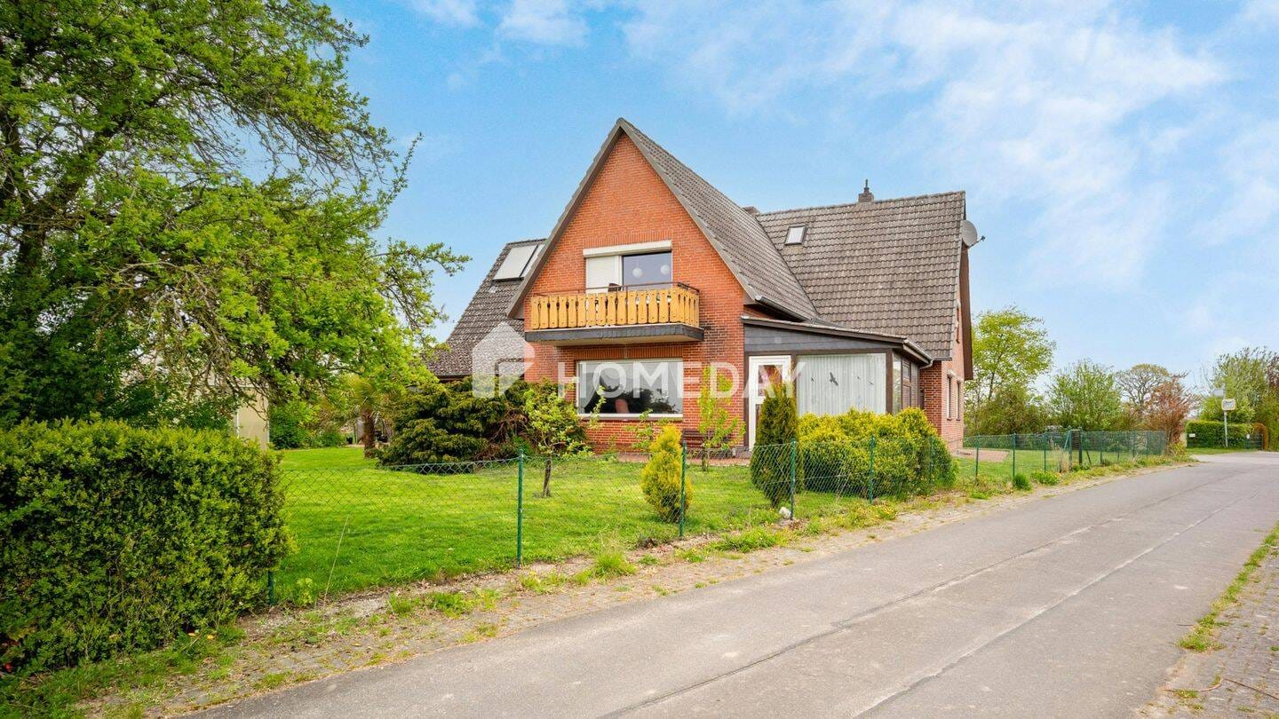 Immobilie in Börgerende-Rethwisch - Zweifamilienhaus mit ca. 300 m² Wohnfläche, Gartenidylle und vielseitigen Nutzungsmöglichkeiten - Bild 0