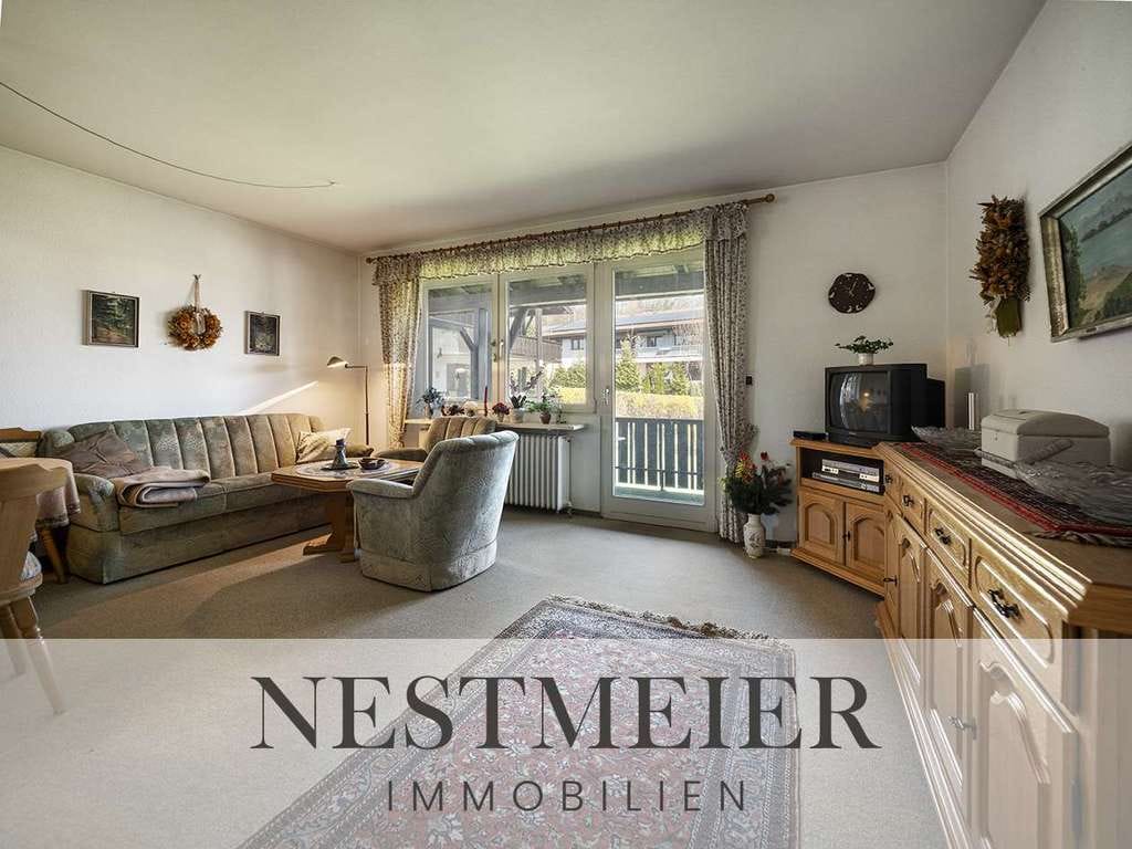 Immobilie in Grabenstätt - Charmante 2-Zimmer-Wohnung mit großem Balkon & viel Gestaltungspotenzial in ruhiger Lage Grabenstätt - Bild 0