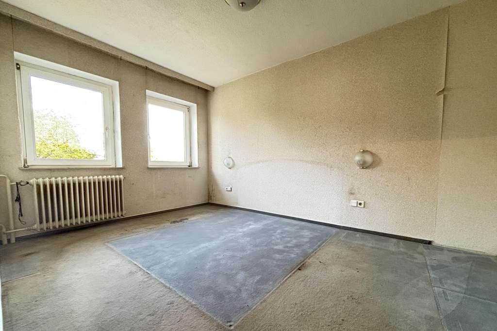 Immobilie in Bad Schwartau - Charmantes Mittelreihenhaus mit Potential in ruhiger Wohnlage - Bild 1