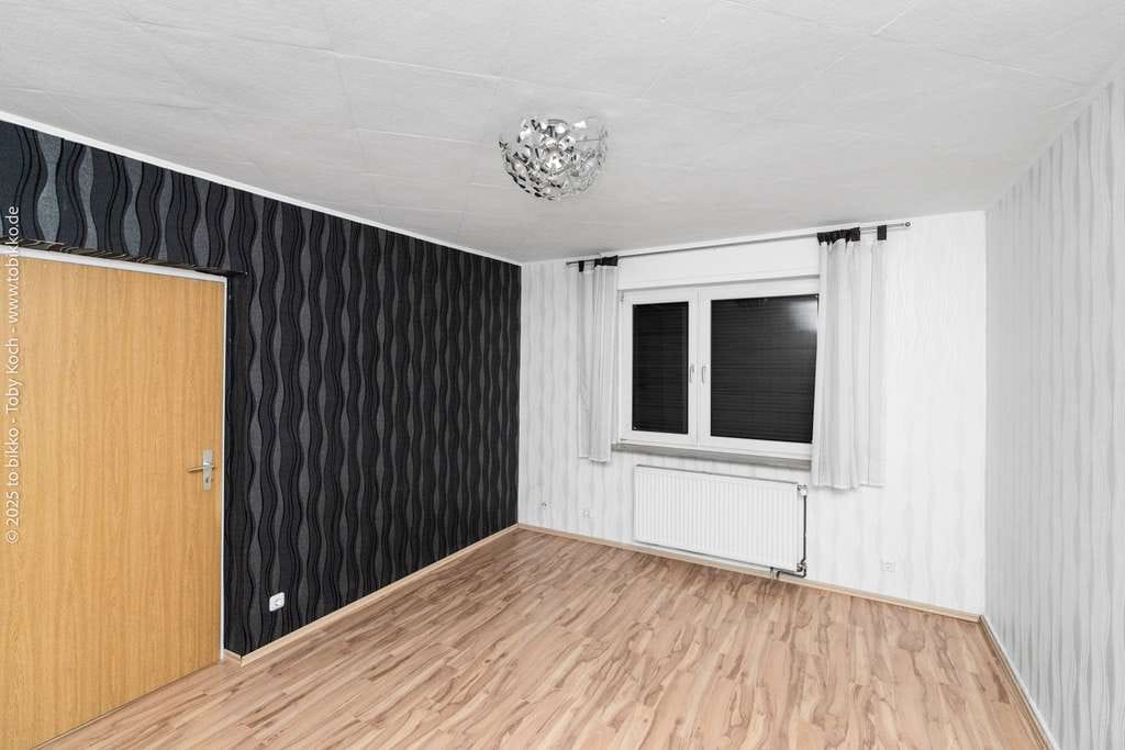 Immobilie in Langen - Vielseitiges Renditeobjekt: Gepflegtes Mehrgenerationenhaus mit drei Wohneinheiten und Ausbaureserve - Bild 2