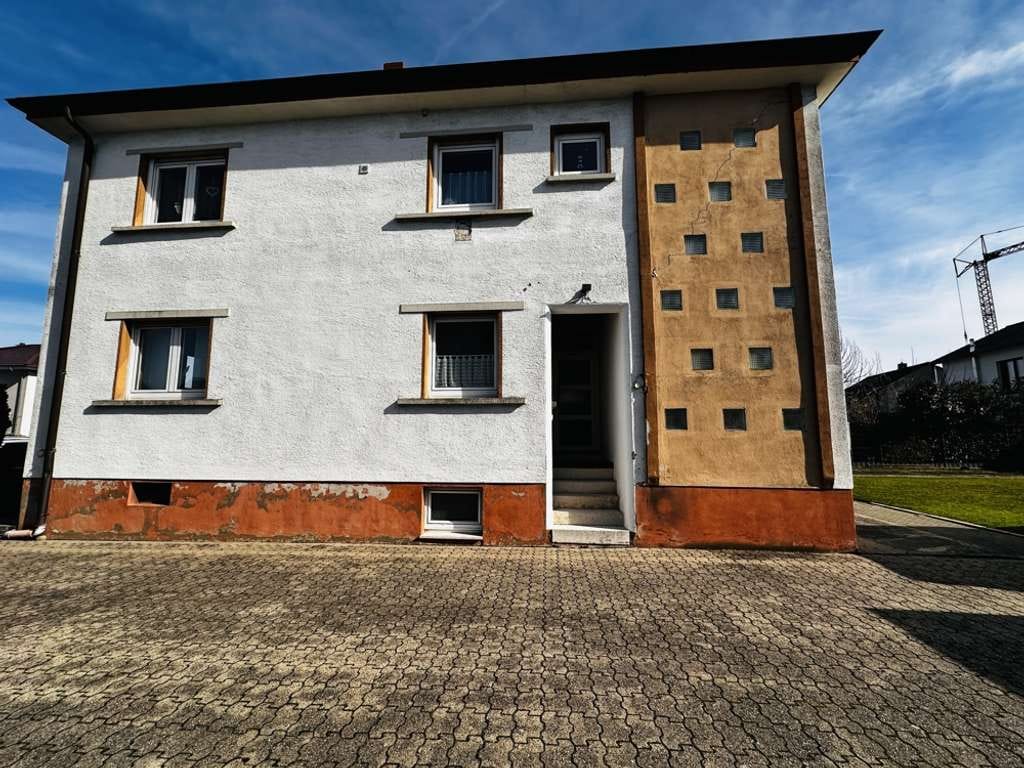 Immobilie in Rülzheim - Zweifamilienhaus mit Entwicklungspotenzial – eine Wohneinheit frei, eine vermietet - Bild 1