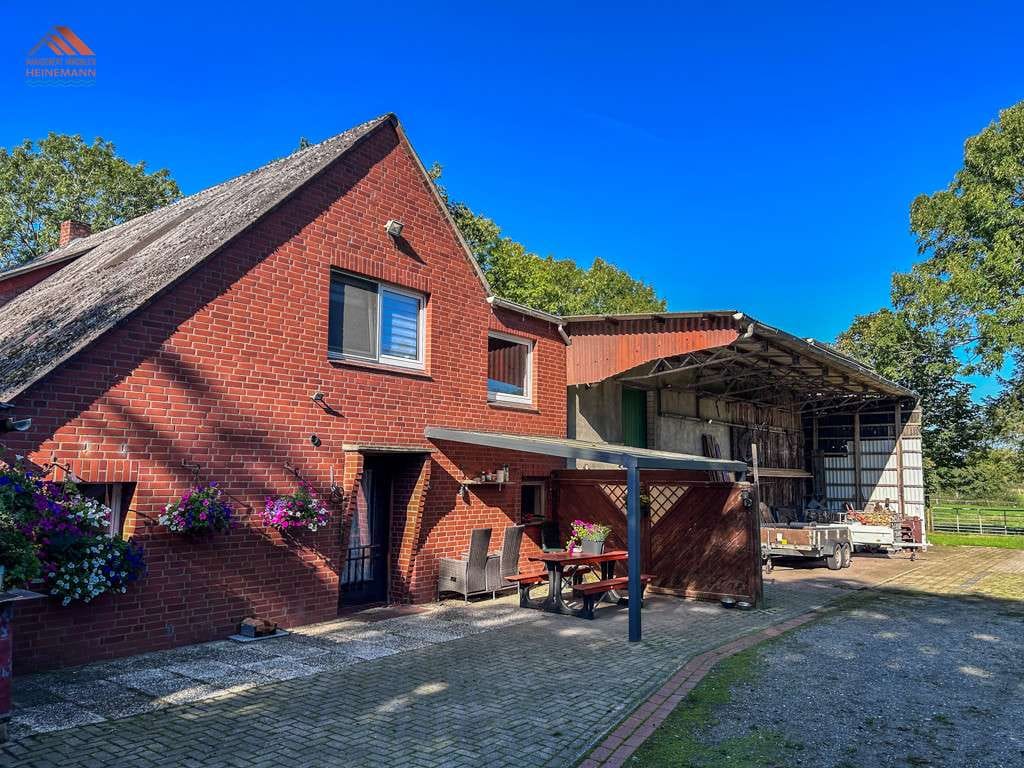 Immobilie in Wurster Nordseeküste - Pferdeliebhaber aufgepasst!  Großes Einfamilienhaus mit Nebengebäuden und viel Land in Spieka - Bild 1