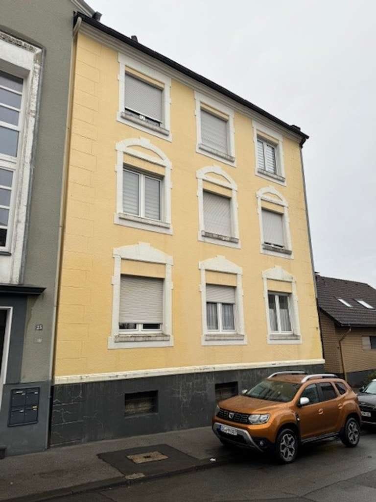Immobilie in Solingen - Solides Mehrfamilienhaus mit 4 Wohnungen, Hof und Nebengebäude in Solingen-Höhscheid. - Bild 1