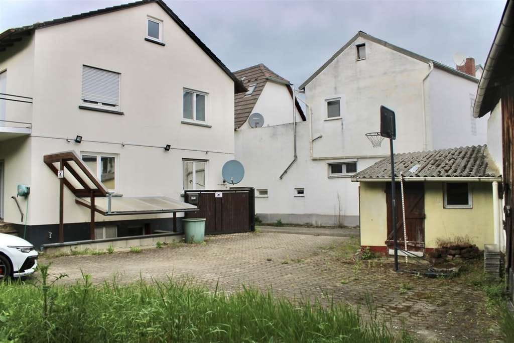 Immobilie in Biblis - Vielseitiges EFH mit Ausbaureserve, Scheune & großem Potenzial in zentraler Lage von Biblis - Bild 1