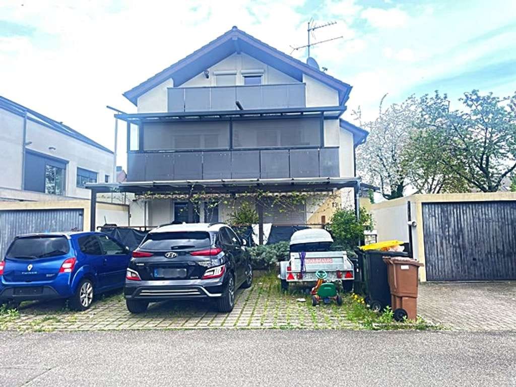 Immobilie in Rastatt - Vier-Zimmer-Wohnung mit Garten und Garage in Rastatt-Rheinau - Bild 1