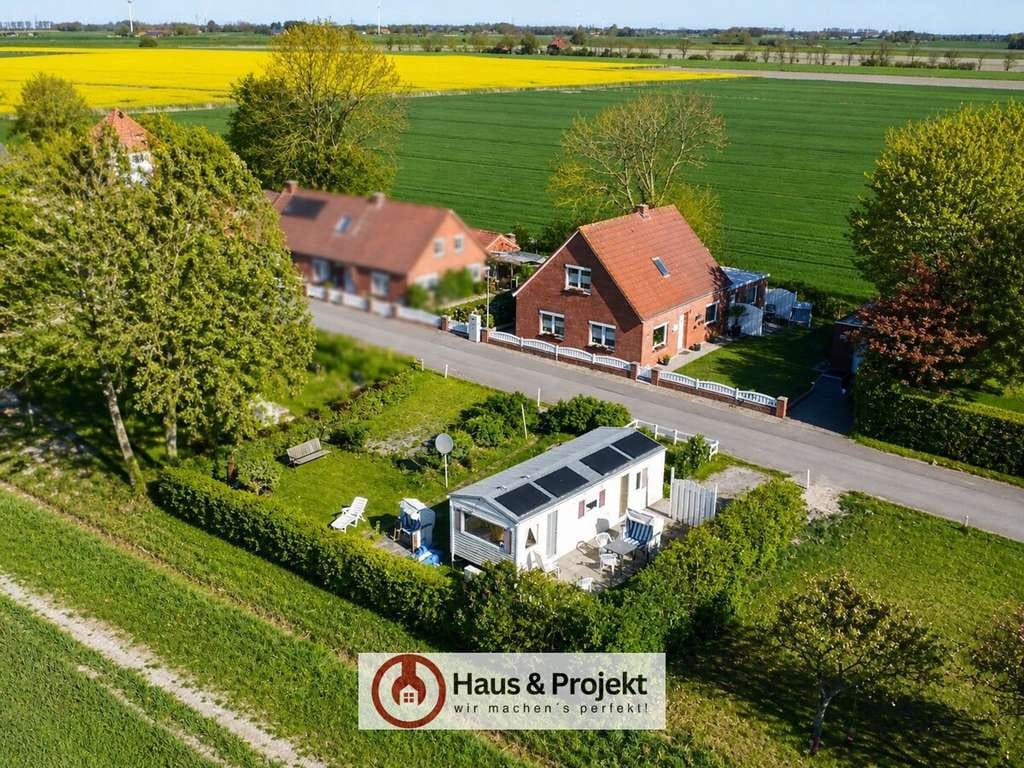 Immobilie in Wirdum - Charmantes EFH mit Einliegerwohnung, zweitem Grundstück & modernem Wohntrailer - Bild 0