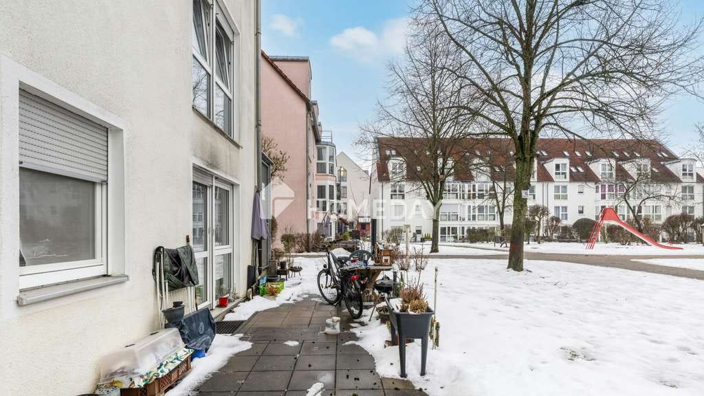 Immobilie in Nittendorf - Attraktive Erdgeschosswohnung in gepflegtem Mehrfamilienhaus mit TG-Stellplatz - Bild 1