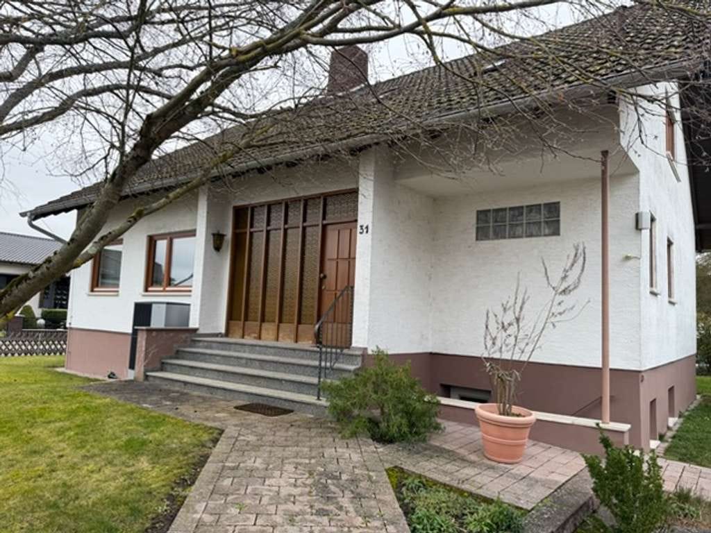 Immobilie in Stockstadt - Grundsolides Einfamilienhaus mit herrlichem Grundstück in bester Wohnlage - Bild 1