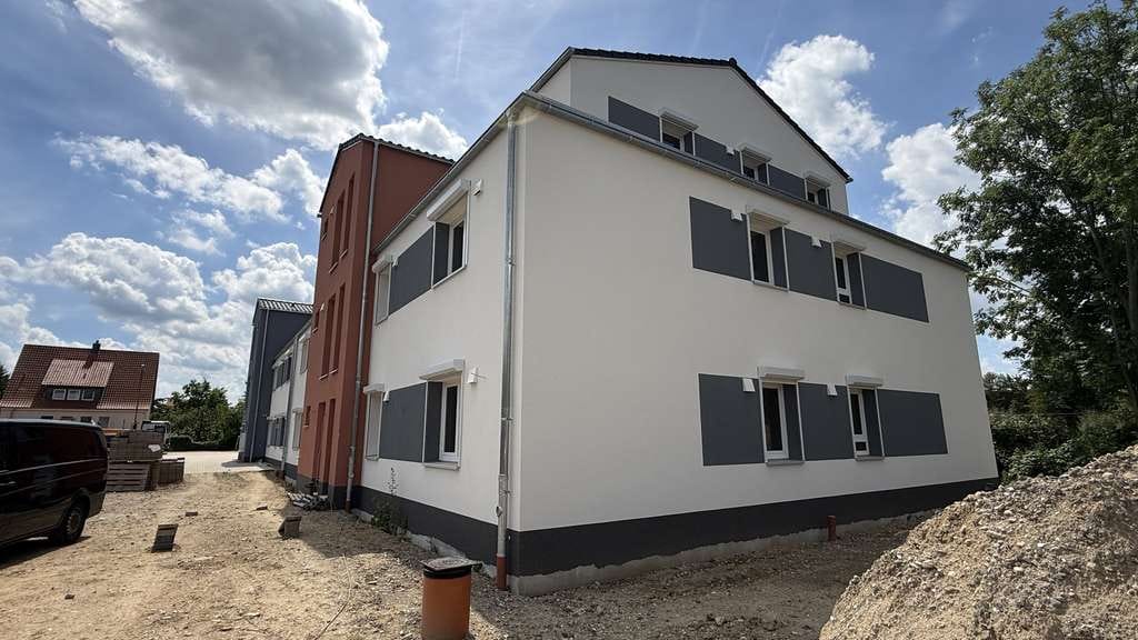Immobilie in Lindhorst - Effizienzhaus 40 QNG 3-Zimmer-Neubauwohnung in zentraler Lage von Lindhorst - Bild 1