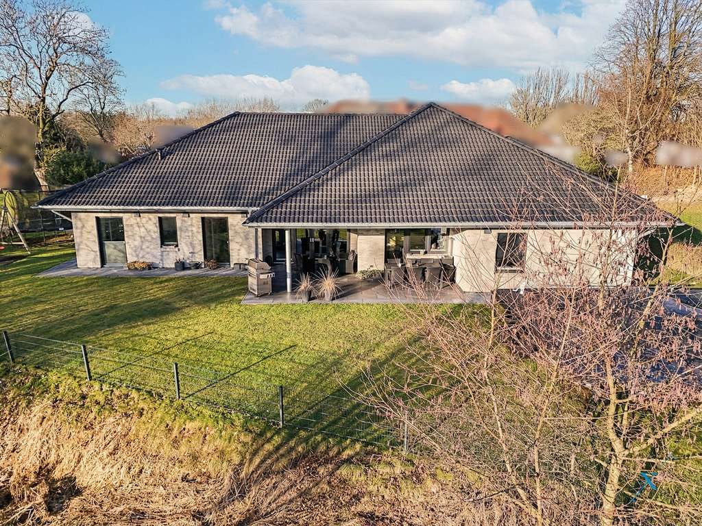 Immobilie in Meyn - Nachhaltig & neuwertig: Hochwertiges KfW-40-Einfamilienhaus in idyllischer Lage direkt an der Au - Bild 1