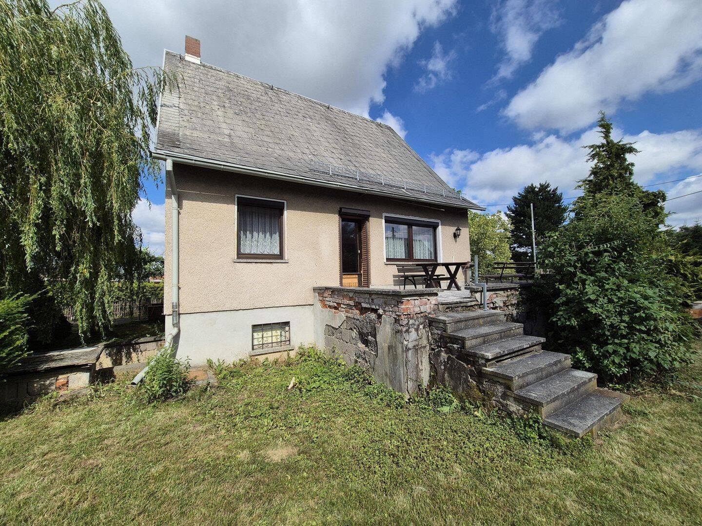 Immobilie in Taura - Raum für neue Wohnideen - Einfamilienhaus mit Terrasse, Garten und Garage - Bild 1