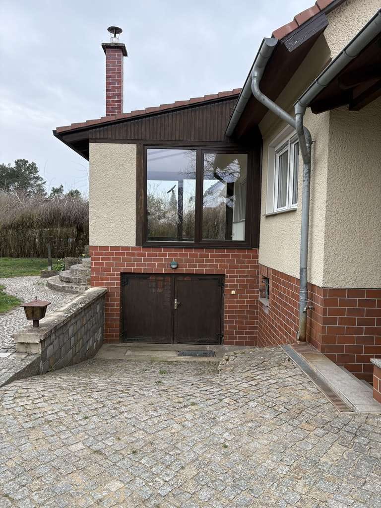 Immobilie in Lübben (Spreewald) - Bezugsfertiges EFH in Lübben – Wintergarten, Kamin, Sauna & Doppelgarage inklusive - Bild 1