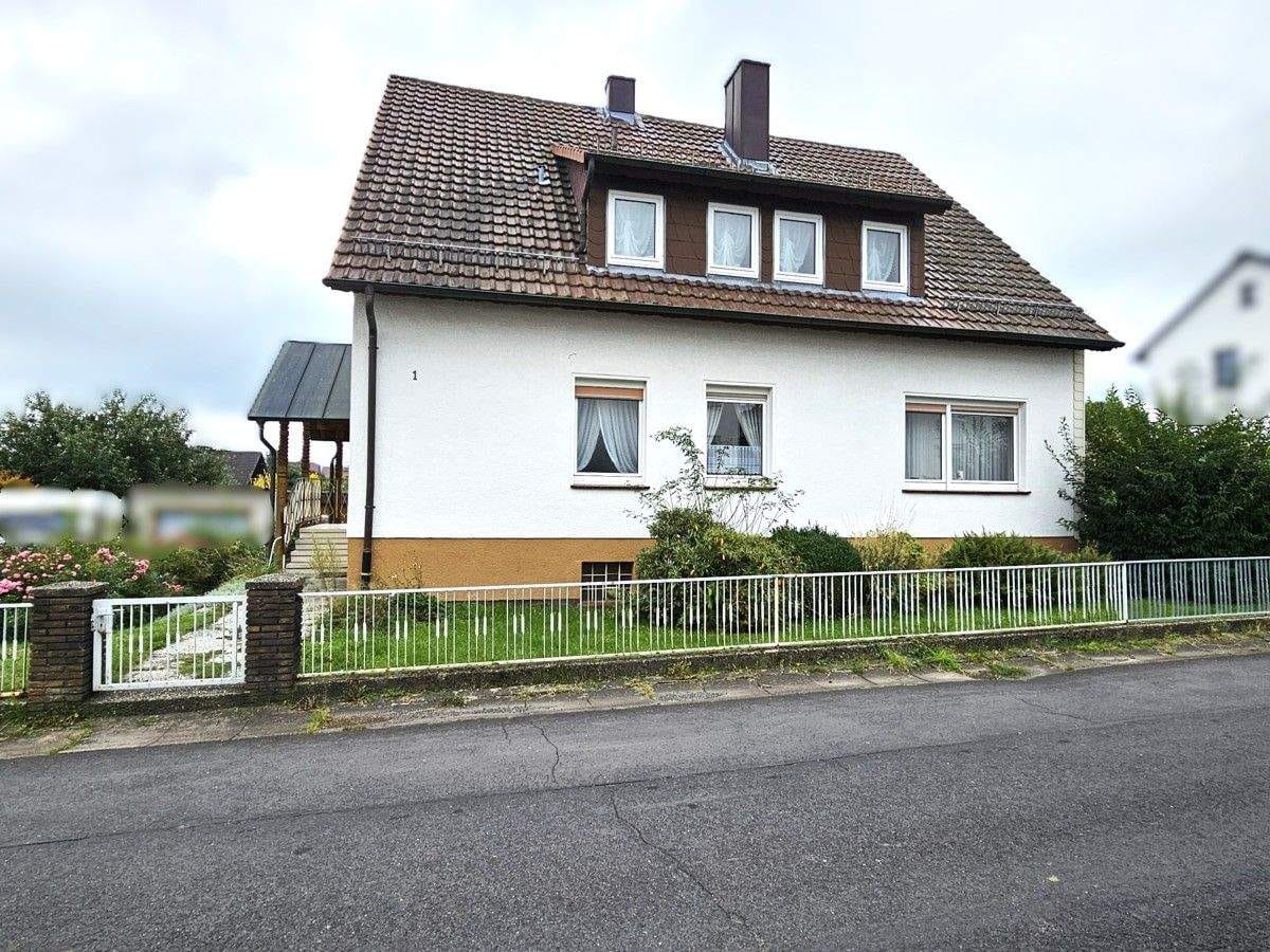 Immobilie in Ahnatal - Gepflegtes Zweifamilienhaus in Ahnatal-Weimar - Bild 1
