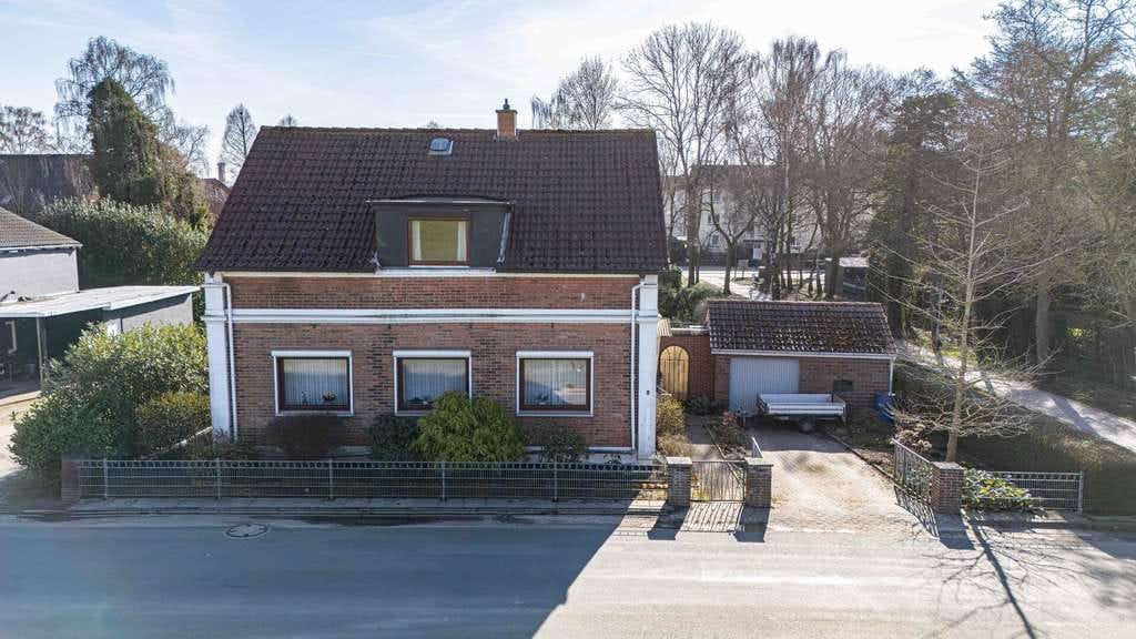 Immobilie in Lemwerder - Flexibles Mehrgenerationenhaus mit weitläufigem Garten und Garage - Bild 3