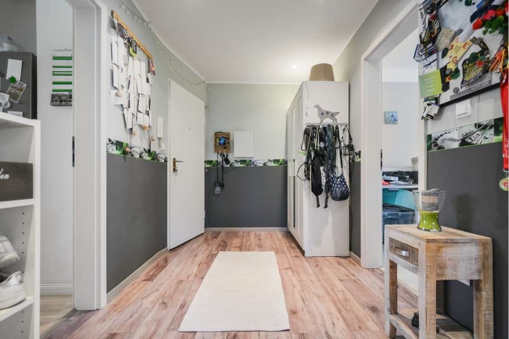 Immobilie in Hartenholm - 3‑Zimmer‑Wohnung mit Gartenanteil, großer Fensterfront & überdachter Terrasse - Bild 1