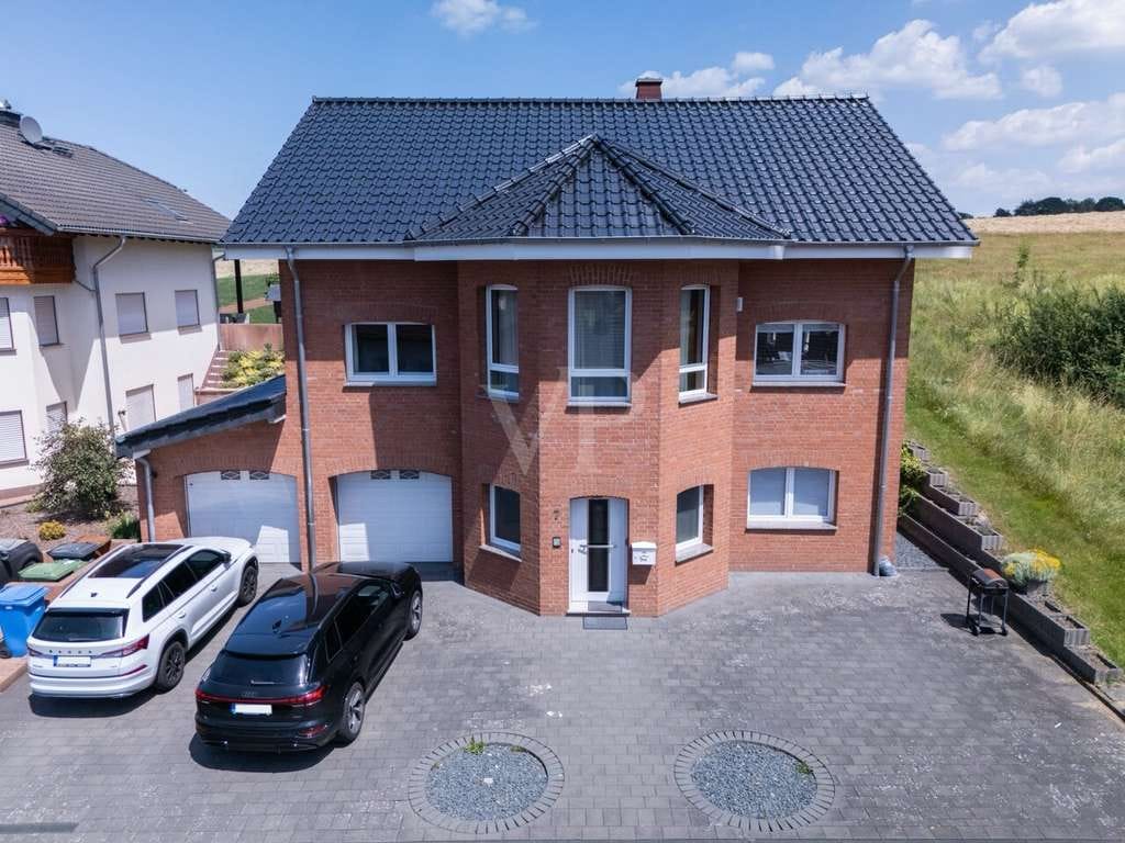 Immobilie in Woldert - Gepflegtes Einfamilienhaus mit Einliegerwohnung und großzügigem Grundstück - Bild 2