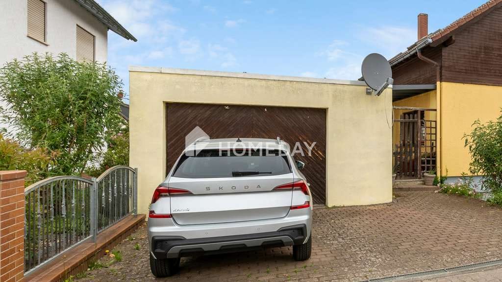 Immobilie in Maxdorf - Teilvermietetes Mehrfamilienhaus mit Garten, Terrasse und Garage in begehrter Wohnlage - Bild 1