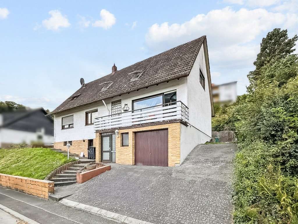 Immobilie in Fronhausen - Schönes, lichtdurchflutetes Einfamilienhaus mit Einliegerwohnung und Garten in Fronhausen - Bild 0
