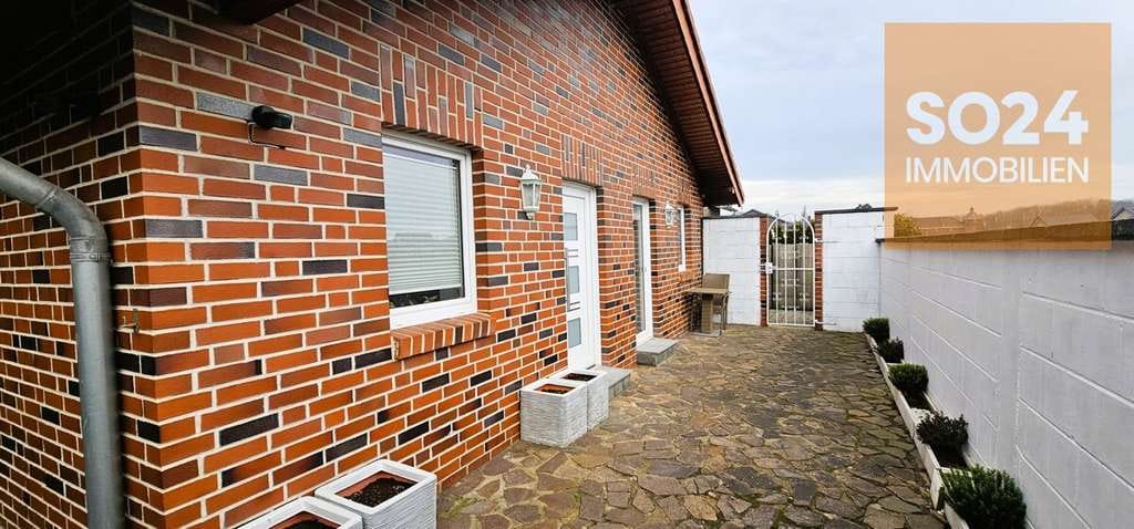 Immobilie in Inden - SO24 Inden Schophoven: Zwei Wohneinheiten,  Garagen, + Carport - Bild 0