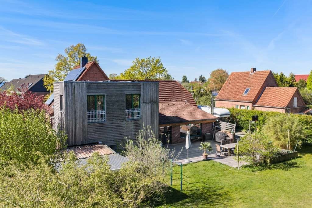 Immobilie in Henstedt-Ulzburg - Familienparadies mit Einliegerwohnung & Traumgarten in ruhiger Lage - Bild 1