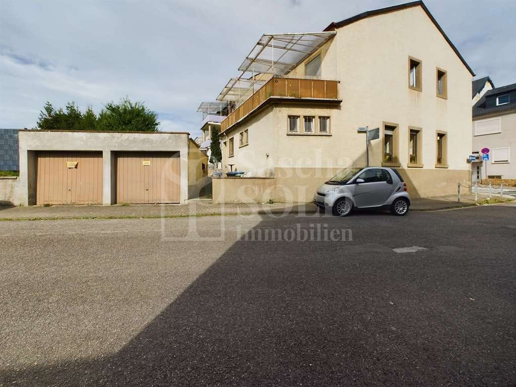 Immobilie in Sankt Ingbert - Wohn- und Geschäftshaus für Investoren in St. Ingbert – mit Wohnung, Gaststätte, Garten und Garagen - Bild 1