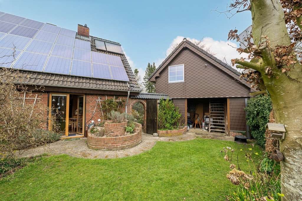 Immobilie in Süderlügum - Umfassend modernisiertes Einfamilienhaus mit Garage auf herrlichem Südgrundstück - Bild 1