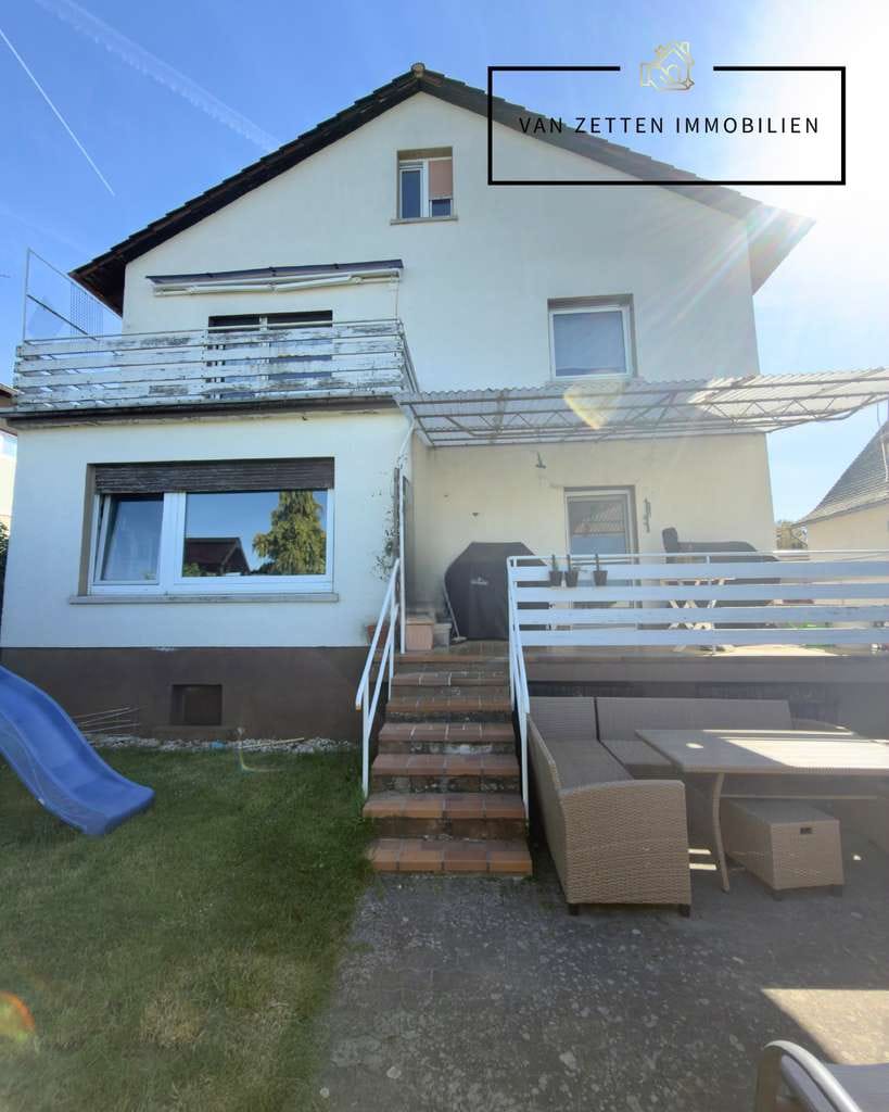 Immobilie in Rockenberg - Ein-Zweifamilienhaus mir großem Garten, Garage und Stellplätzen - Bild 1