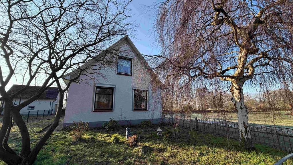 Immobilie in Moorrege - Charmantes Einfamilienhaus auf großzügigem Grundstück in begehrter Lage von Moorrege - Bild 1