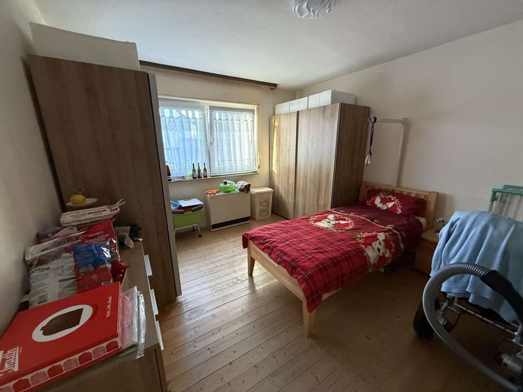 Immobilie in Eggenstein-Leopoldshafen - Attraktive Kapitalanlage: Dreifamilienhaus mit Balkonen & 2 Garagen - Bild 1