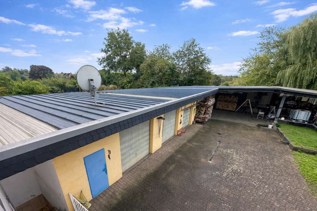 Immobilie in Wadgassen - Attraktives freistehendes Mehrfamilienhaus mit 5 Wohneinheiten und großzügigen Lagerflächen - Bild 2