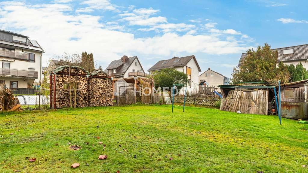 Immobilie in Schauenburg - Einfamilienhaus mit zwei Wohnbereichen, großer Garage und Büro/Gewerbefläche - Bild 1