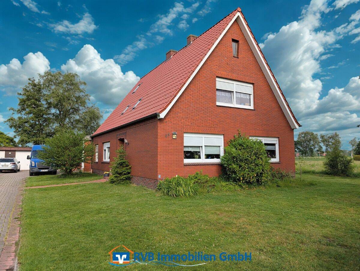 Immobilie in Neukamperfehn - Handwerker aufgepasst - vermietetes Einfamilienhaus mit unverbautem Blick - Bild 0