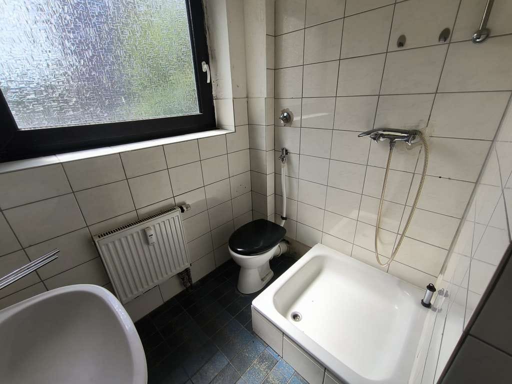 Immobilie in Übach-Palenberg - MGI - Sanierungsbedürftige Eigentumswohnung in Übach-Palenberg - Bild 1