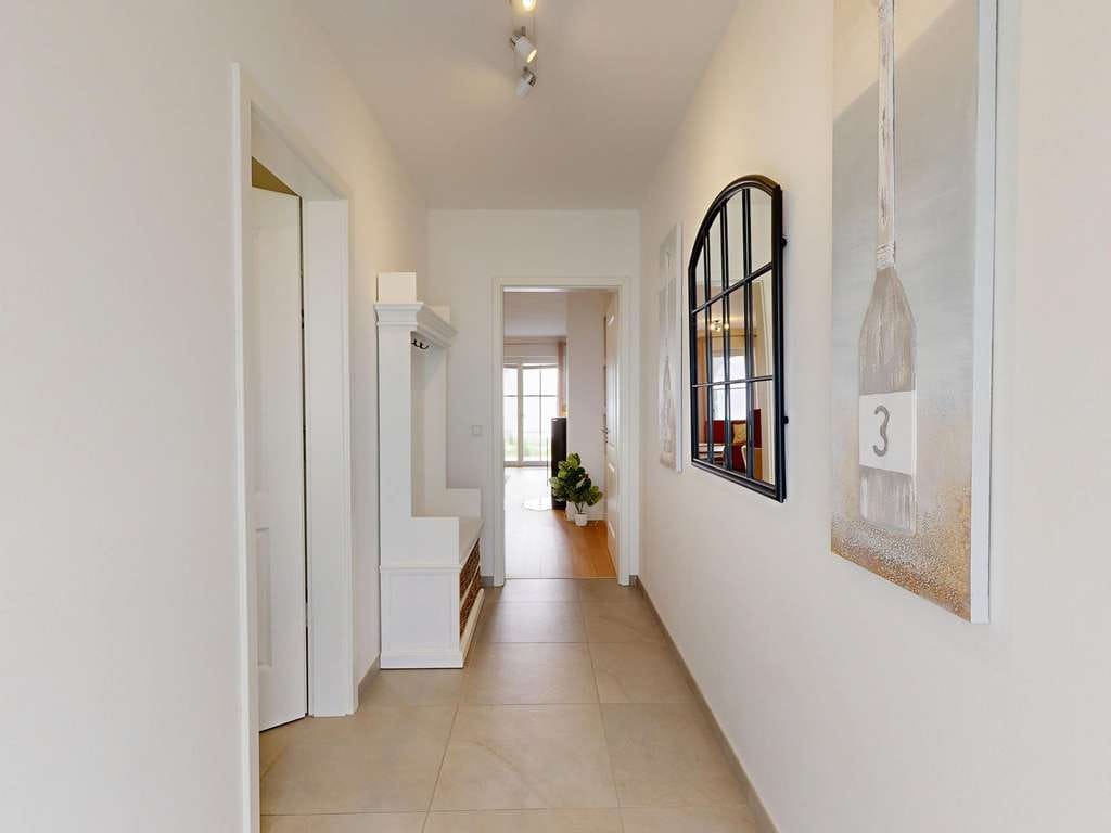 Immobilie in Wustrow - Modernes Ferienapartment im Erdgeschoss mit Süd-West Terrasse und Kamin - Bild 1