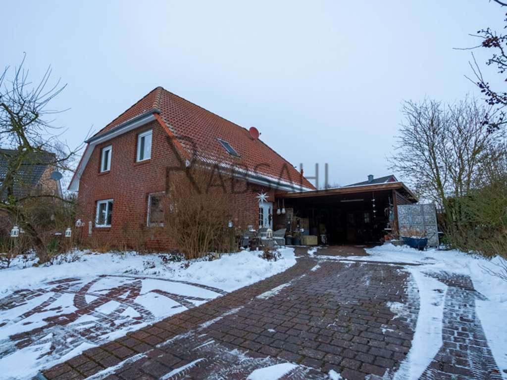 Immobilie in Bienenbüttel - Attraktives Einfamilienhaus mit wundervollem Garten und Doppelcarport - Feldrandlage in Bienenbüttel - Bild 2