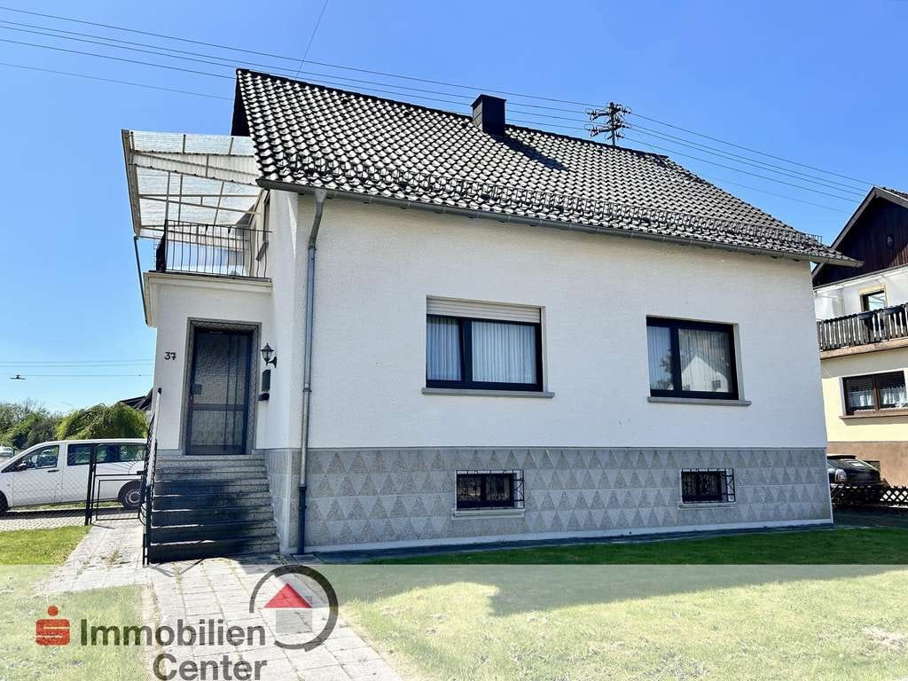 Immobilie in Weiskirchen - Gepflegtes 1-2 Familienhaus mit Bauplatz in Rappweiler - Bild 0