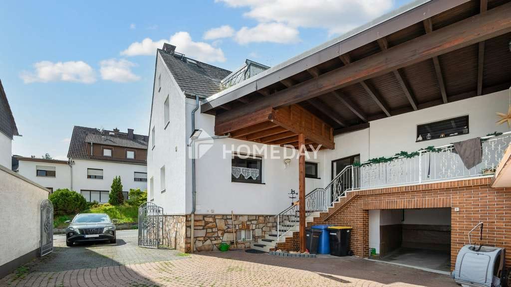Immobilie in Hünstetten - Attraktives Zweifamilienhaus mit Vermietungs- und Eigennutzungsmöglichkeiten - Bild 1