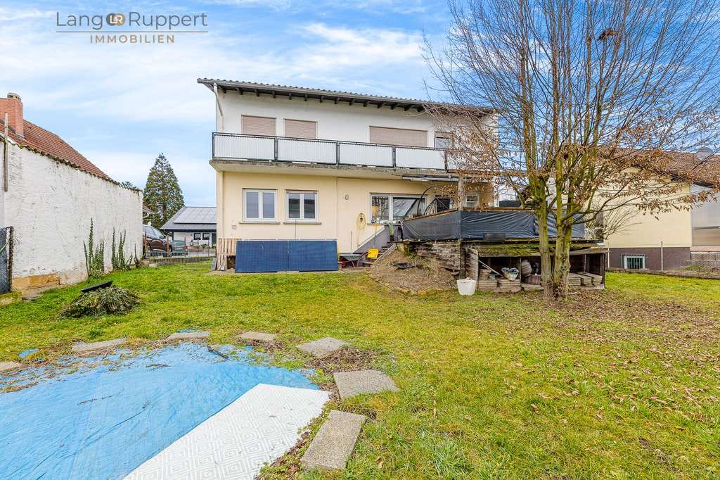 Immobilie in Biblis - Vermietetes, teilmodernisiertes Zweifamilienhaus mit Garten - Bild 3