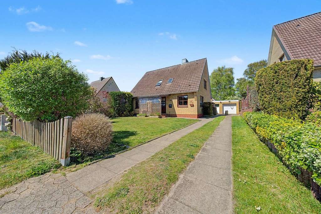 Immobilie in Breitenburg - Vermietetes Einfamilienhaus mit Garage - Bild 1