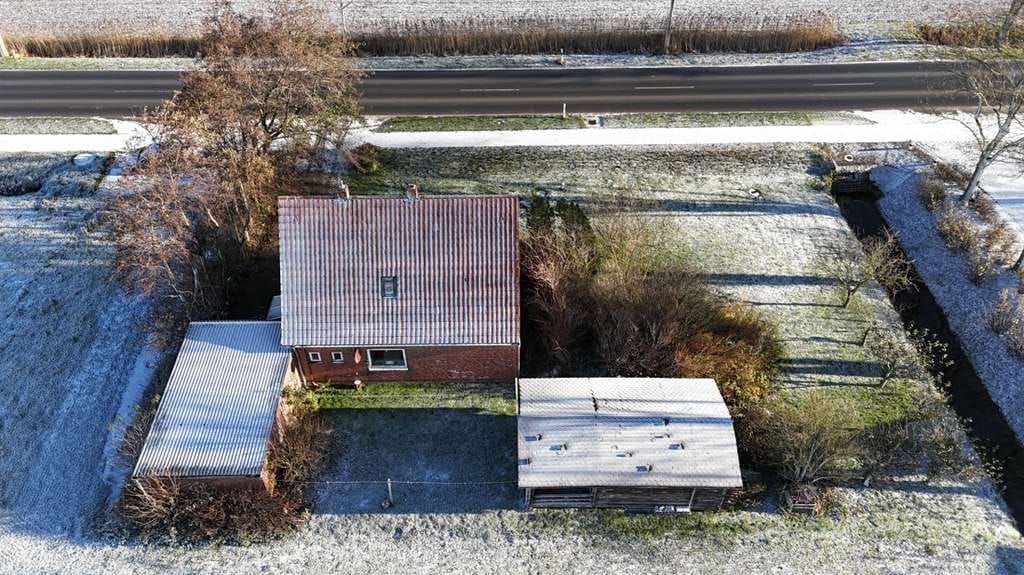Immobilie in Friedrichskoog - Einfamilienhaus mit Blick über die offene Feldlandschaft - Bild 2