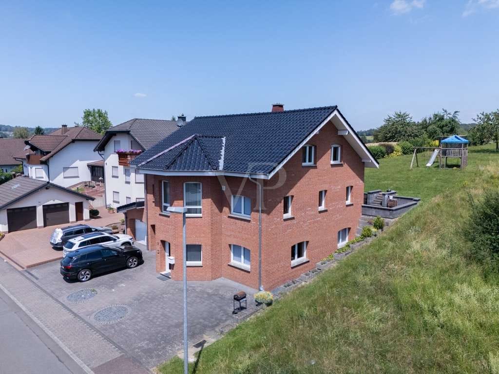 Immobilie in Woldert - Gepflegtes Einfamilienhaus mit Einliegerwohnung und großzügigem Grundstück - Bild 1