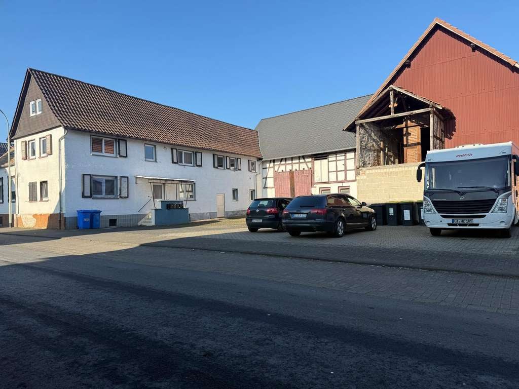 Immobilie in Hungen - Mehrfamilienhaus mit 7 Einheiten und Baugrundstück - Bild 1