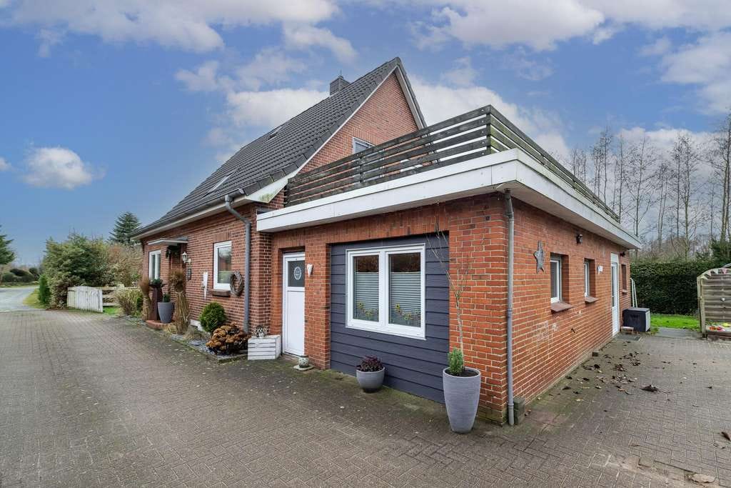 Immobilie in Struckum - Ein Ort zum Wohlfühlen: Einfamilienhaus mit schönem Garten und Carport - Bild 2