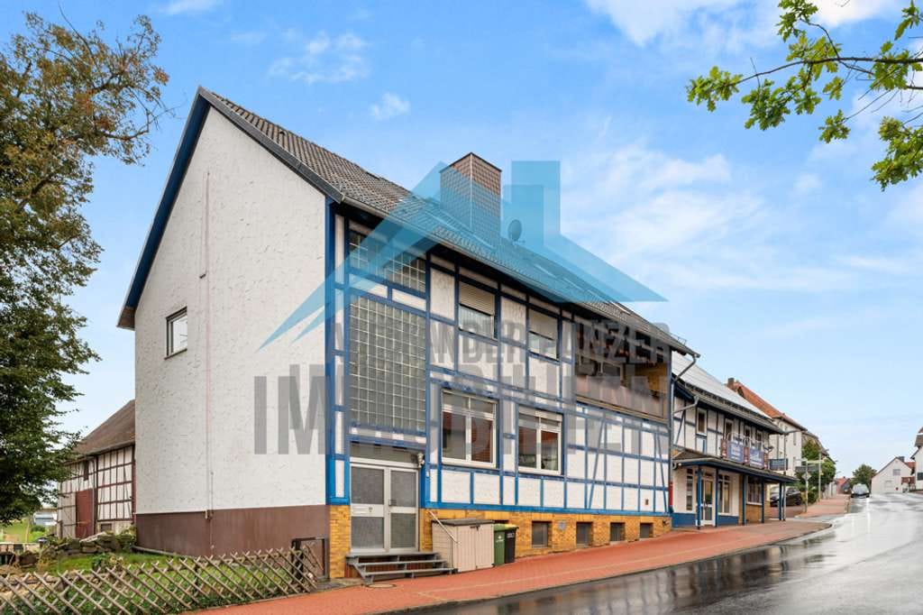Immobilie in Espenau - Kapitalanlage - Wohn- & Geschäftshaus in gut sichtbarer Lage von Espenau! - Bild 1